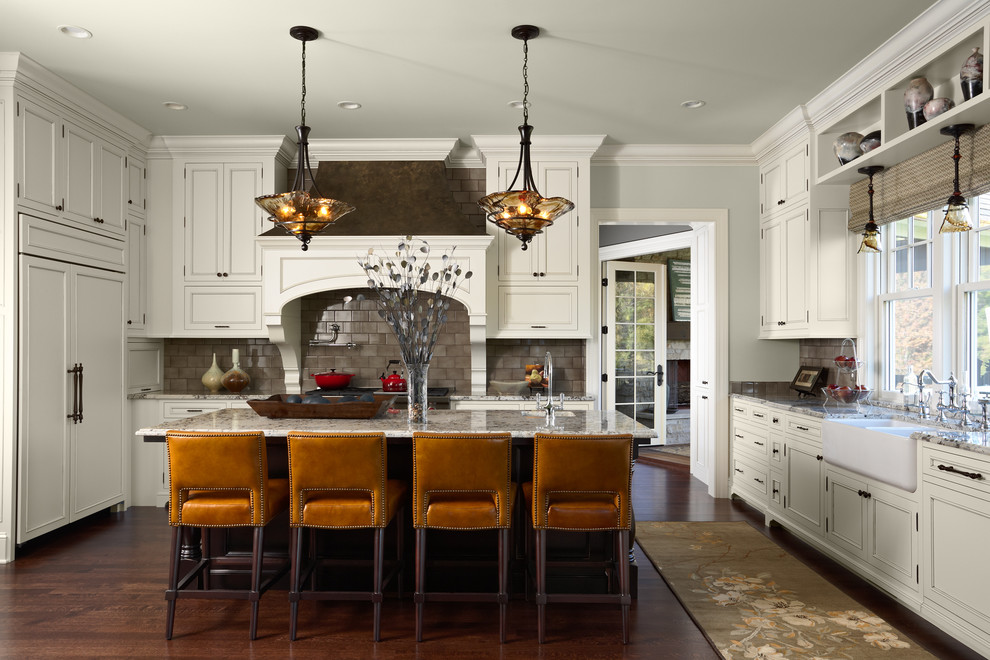 white granite kitchen surfaces with mustard yellow chairs at breakfast bar